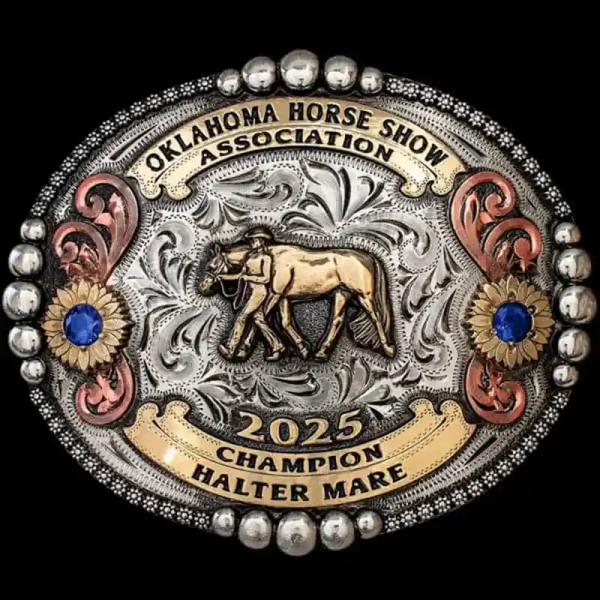 "A Western classic — our Texhoma Belt Buckle.
Handcrafted on a German Silver base, with immaculate details on every inch. This buckle design features a berry and bead edge combination, Copper scrolls accented with sunflowers, and your choice of cubi
